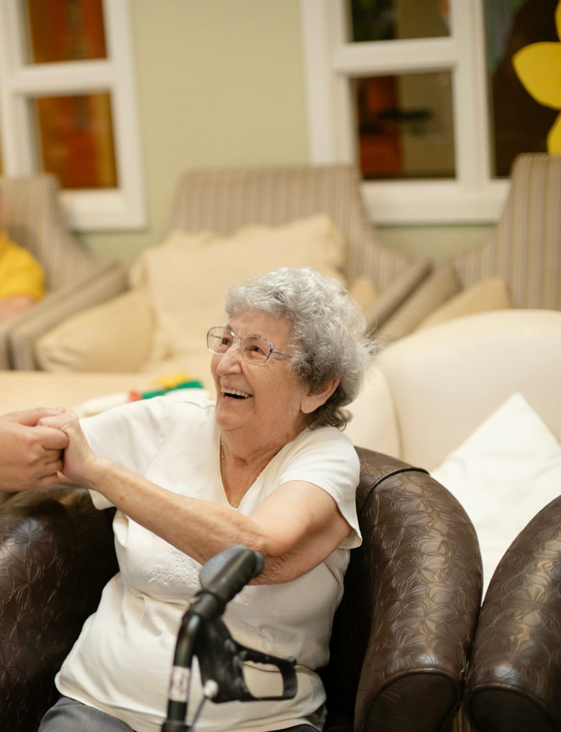 A Zion Care Services caregiver sharing a laugh with a senior client at home