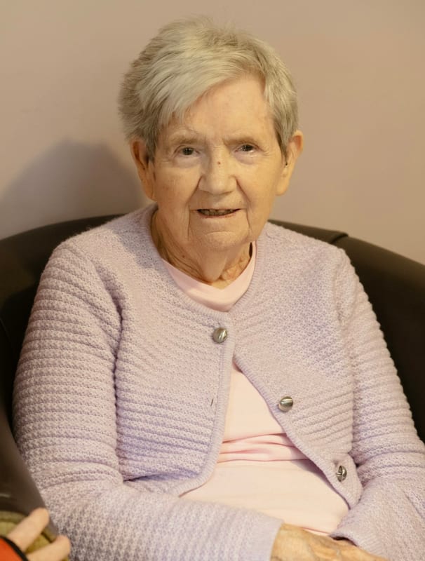 A senior resting comfortably at home